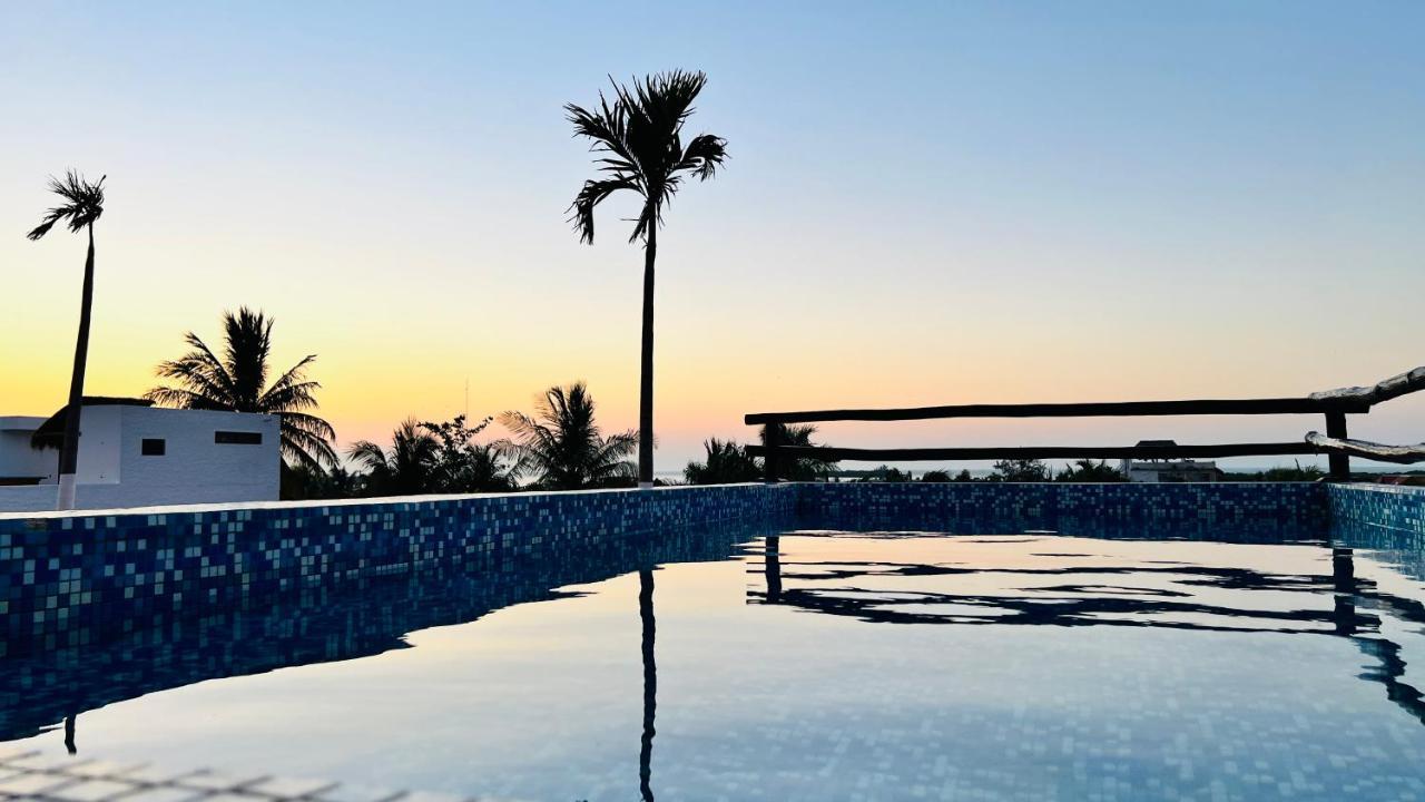 Hotel Mayari Holbox Экстерьер фото Sunset at the beach